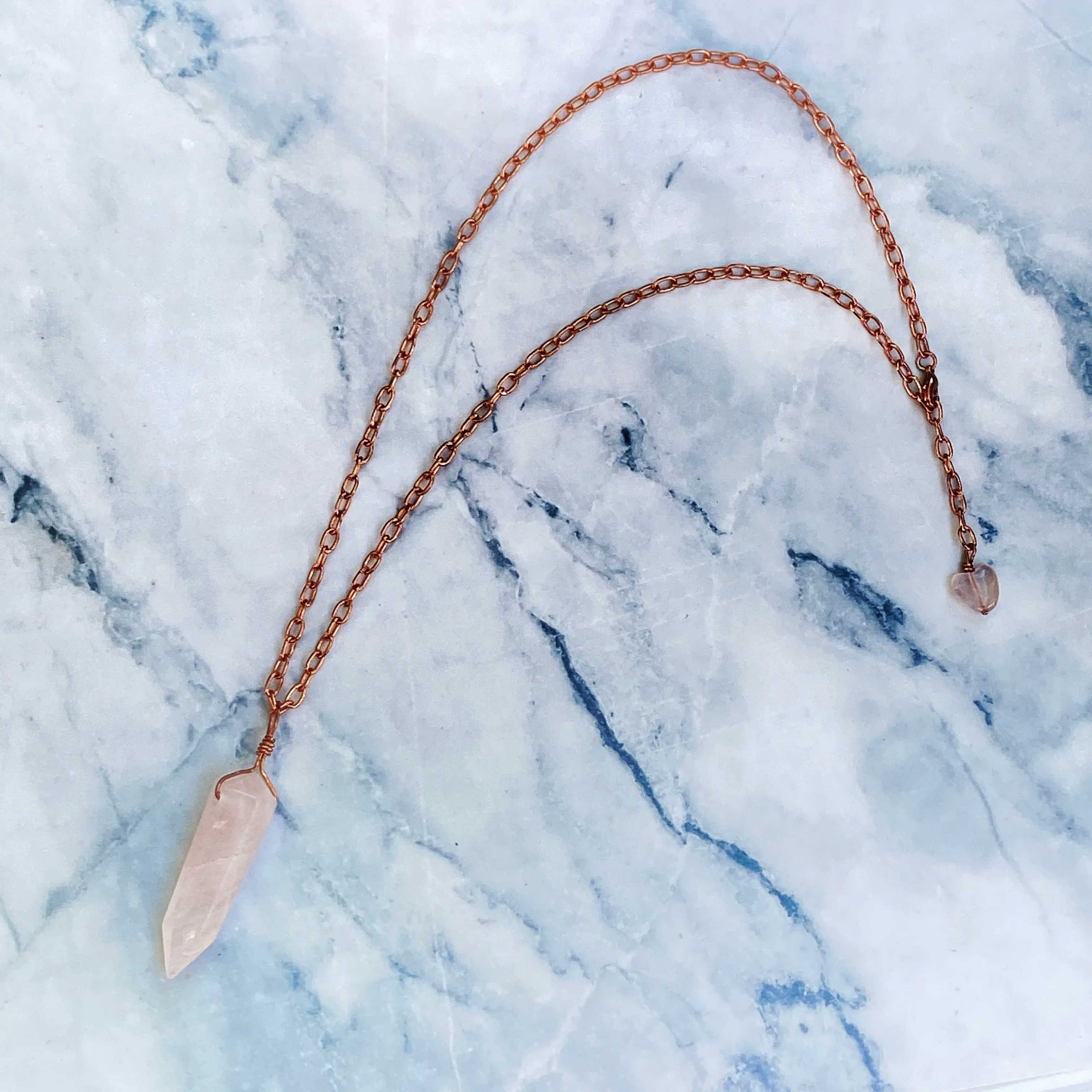 Rose quartz pendant on copper chain necklace